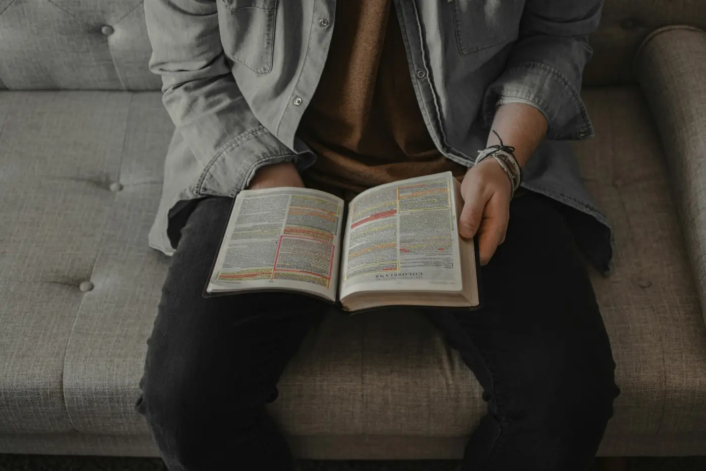 A person reading an open Bible